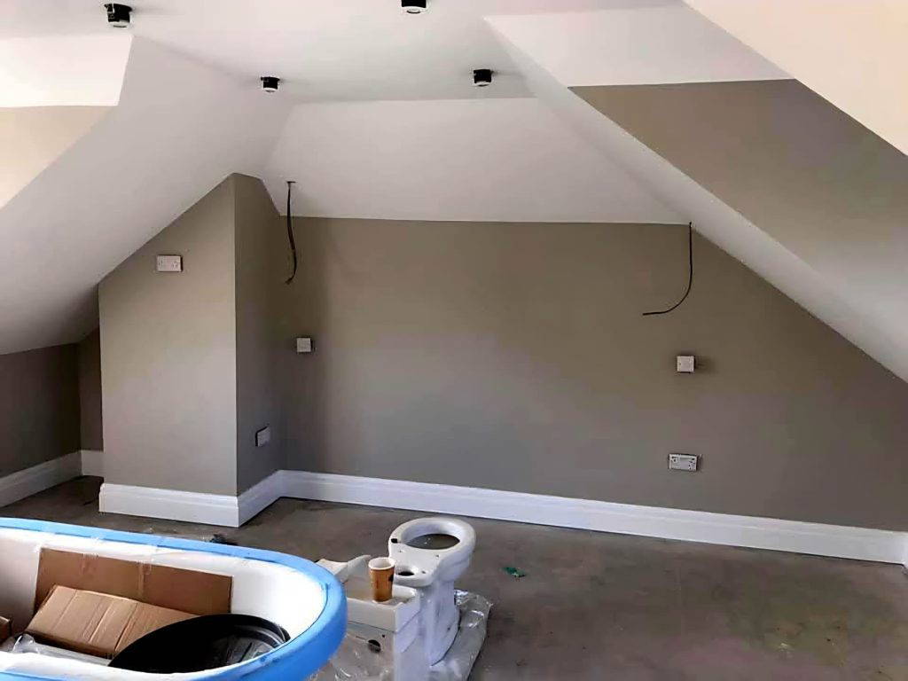 An image of a newly done interior work. The wall is painted in dual colours.